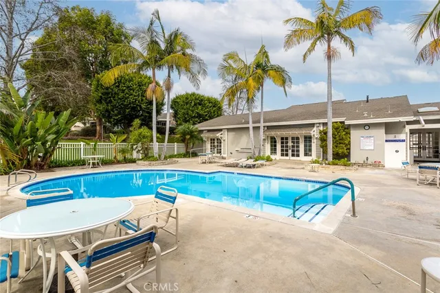 a view of a swimming pool with a lounge chair