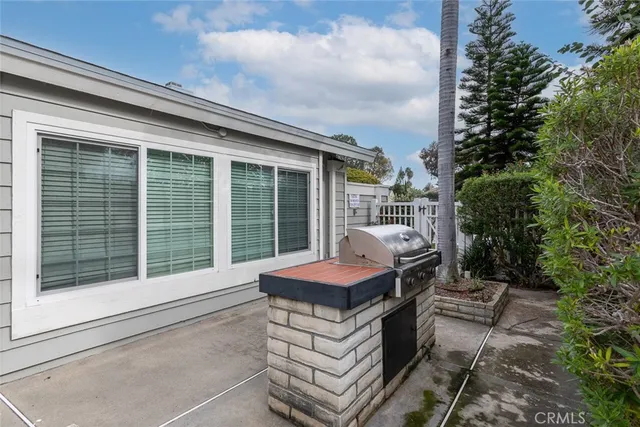 a living room with lots of furniture and a chandelier
