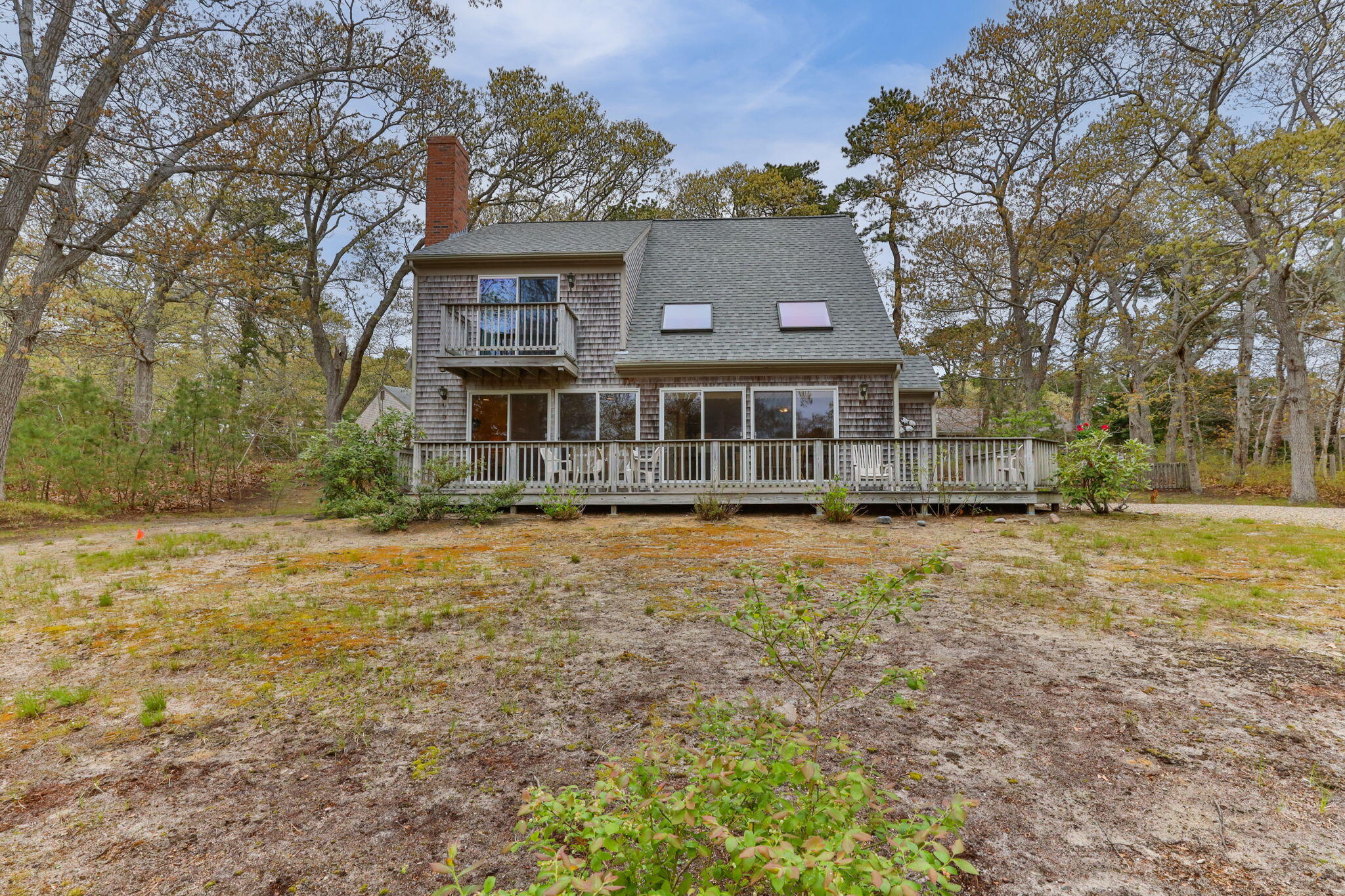 285 Blue Heron Road Wellfleet, MA 02667 - Photo 26 of 31 a front view of a house with a yard