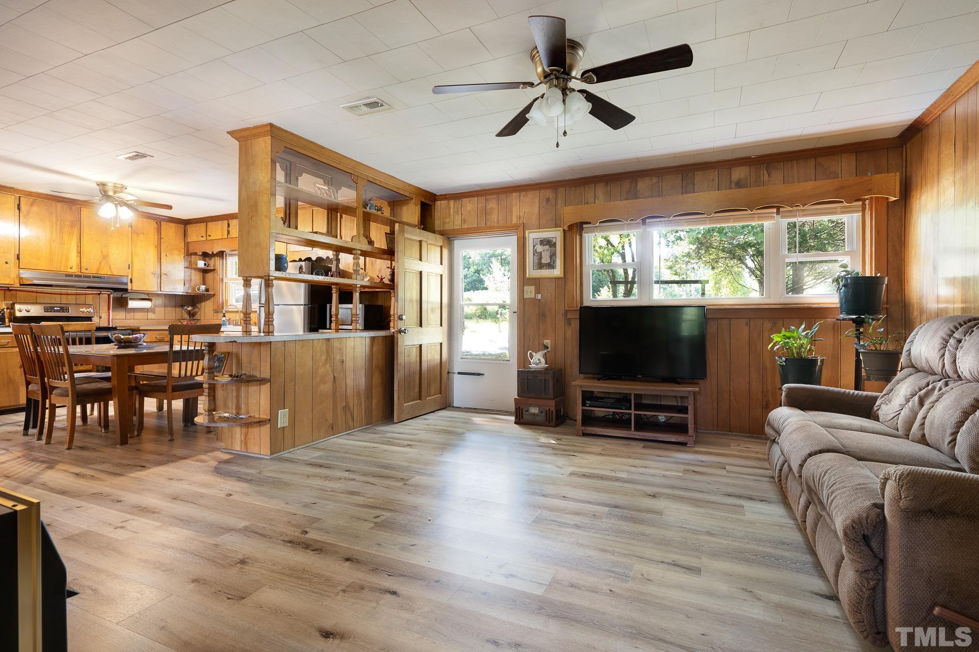 724 Bill Poole Road Rougemont, NC 27572 - Photo 3 of 17 a living room with furniture and a flat screen tv