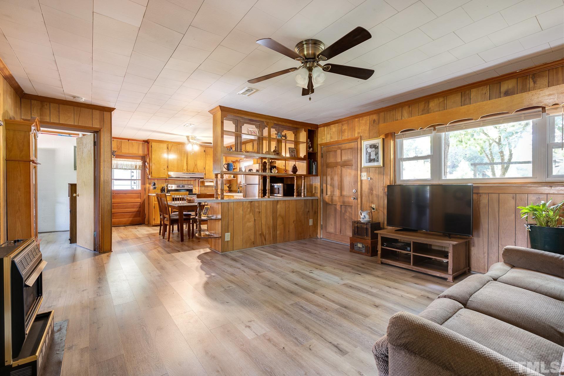 724 Bill Poole Road Rougemont, NC 27572 - Photo 5 of 17 a living room with furniture and a flat screen tv