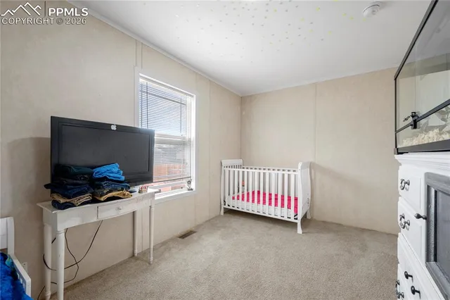 a room with furniture and flat screen tv