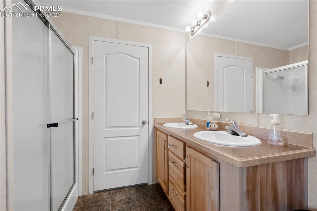 8395 Commanche Road Colorado Springs, CO 80926 - Photo 19 of 29 a bathroom with a sink and a mirror