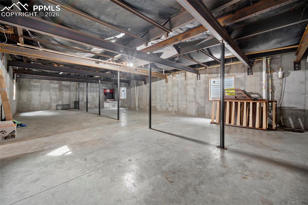 8395 Commanche Road Colorado Springs, CO 80926 - Photo 20 of 29 a view of an empty room with wooden fence