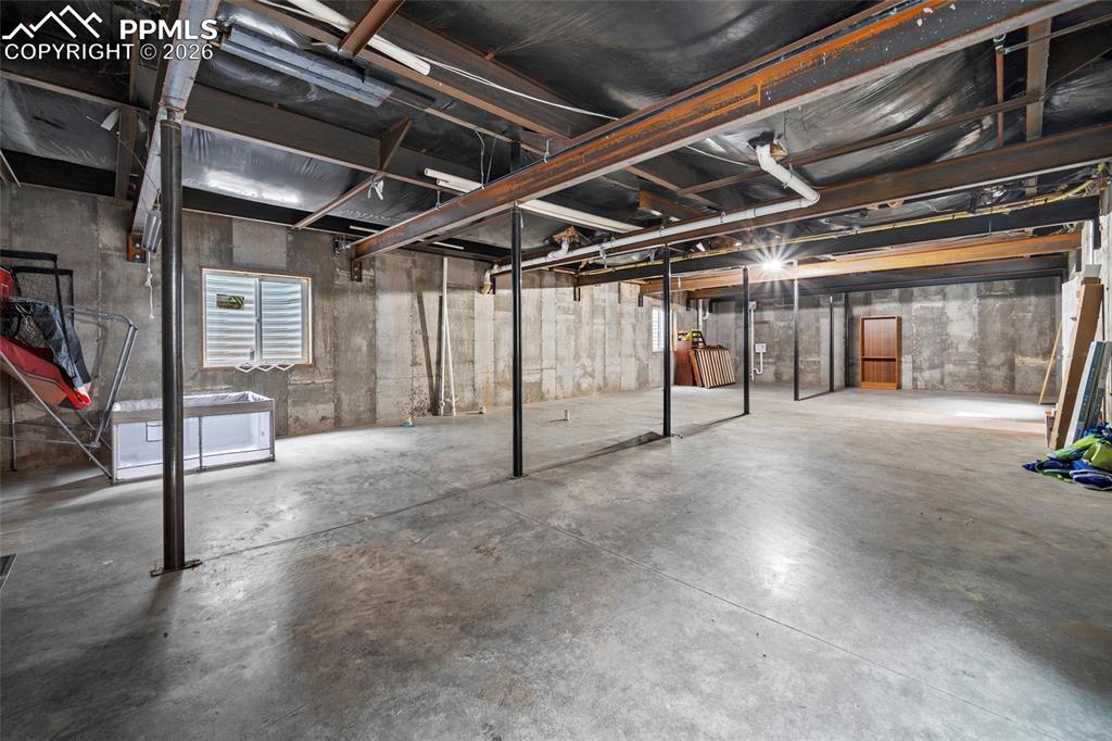 8395 Commanche Road Colorado Springs, CO 80926 - Photo 21 of 29 a view of a room with wooden walls