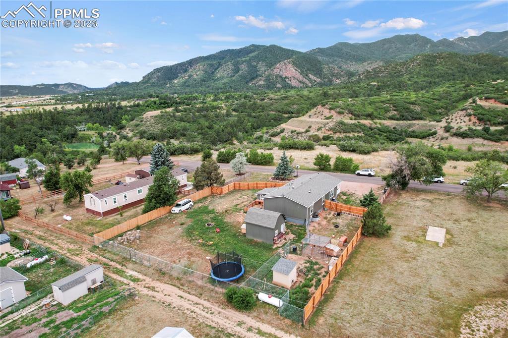 8395 Commanche Road Colorado Springs, CO 80926 - Photo 24 of 29 an aerial view of a city with lots of residential buildings