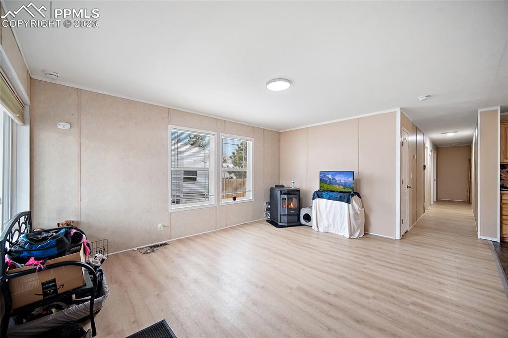 8395 Commanche Road Colorado Springs, CO 80926 - Photo 5 of 29 a view of a room with wooden floor and a window