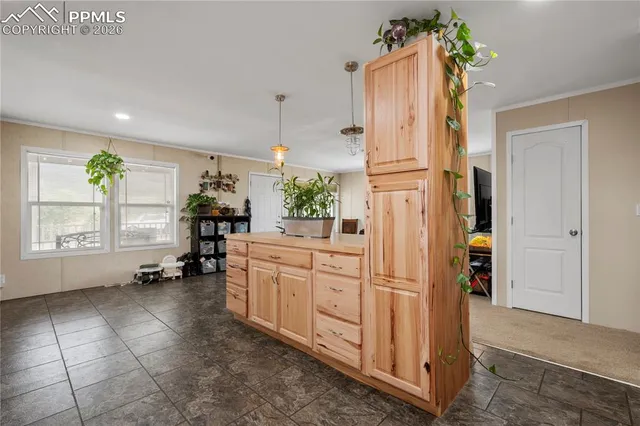 a kitchen with stainless steel appliances granite countertop a refrigerator and a stove