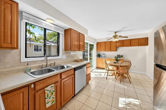 a kitchen with a sink cabinets and window