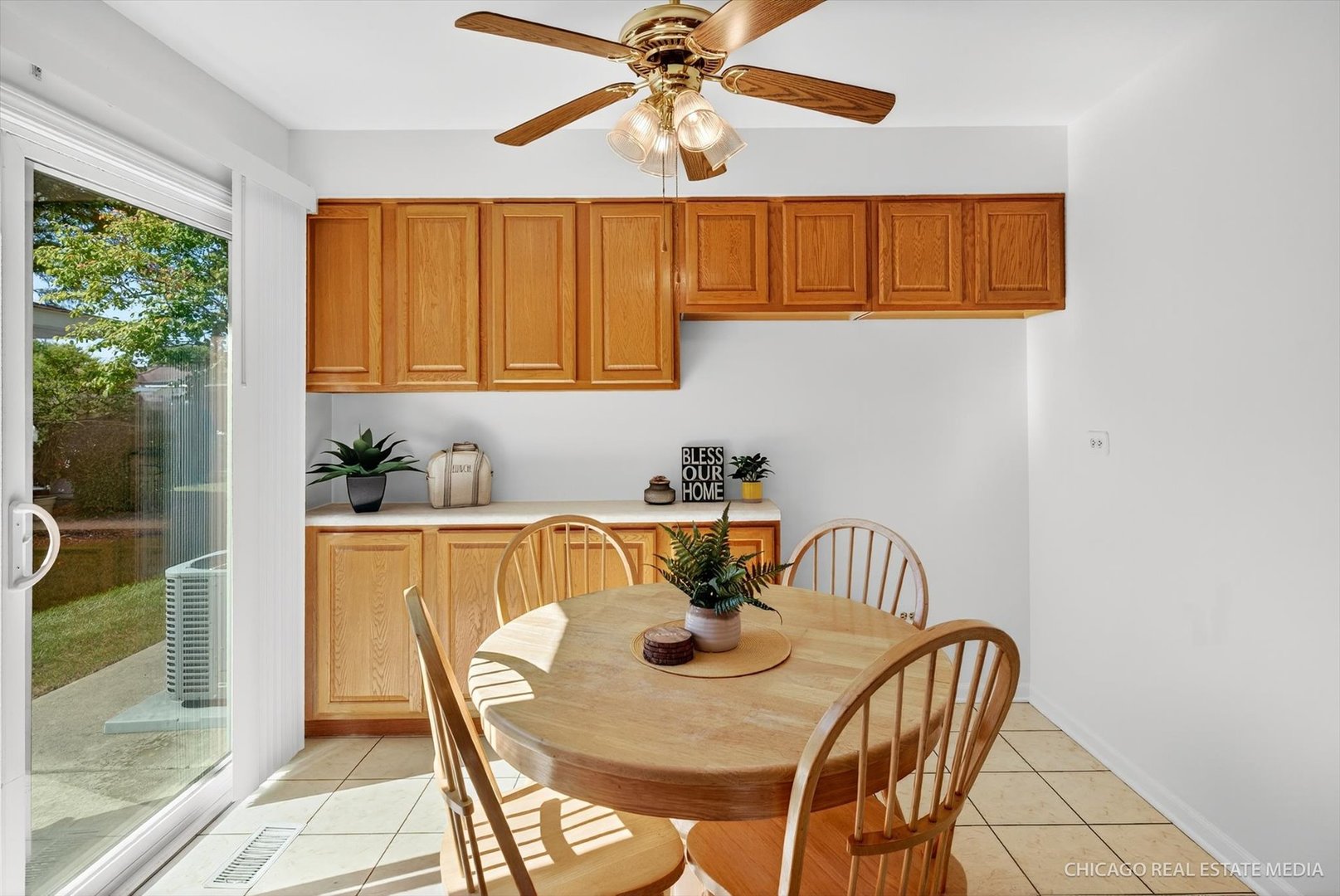 1069 Mohegan Lane Schaumburg, IL 60193 - Photo 9 of 31 a view of a dining room with furniture window and outside view