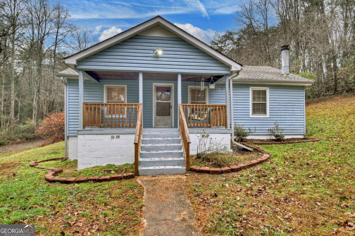 front view of a house with a yard