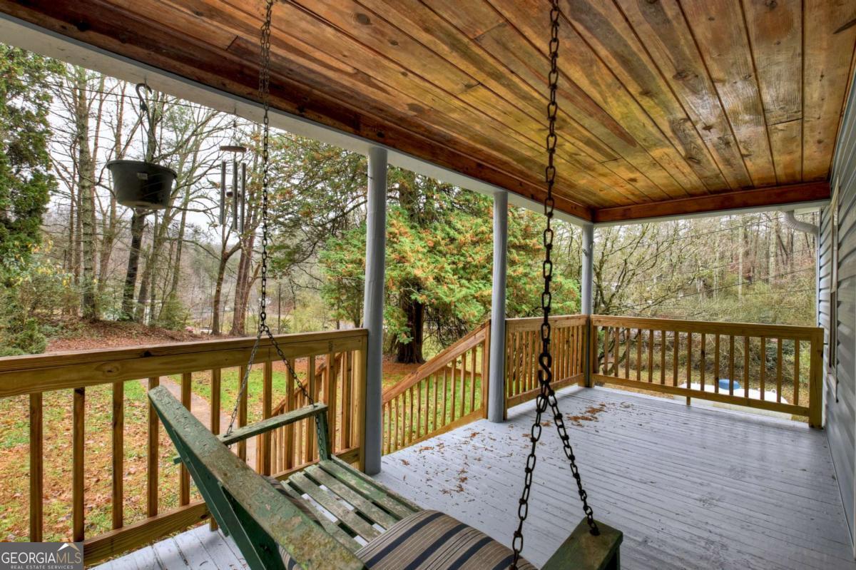 6 Old Aska Curve Blue Ridge, GA 30513 - Photo 11 of 26 a view of a porch with furniture and wooden deck