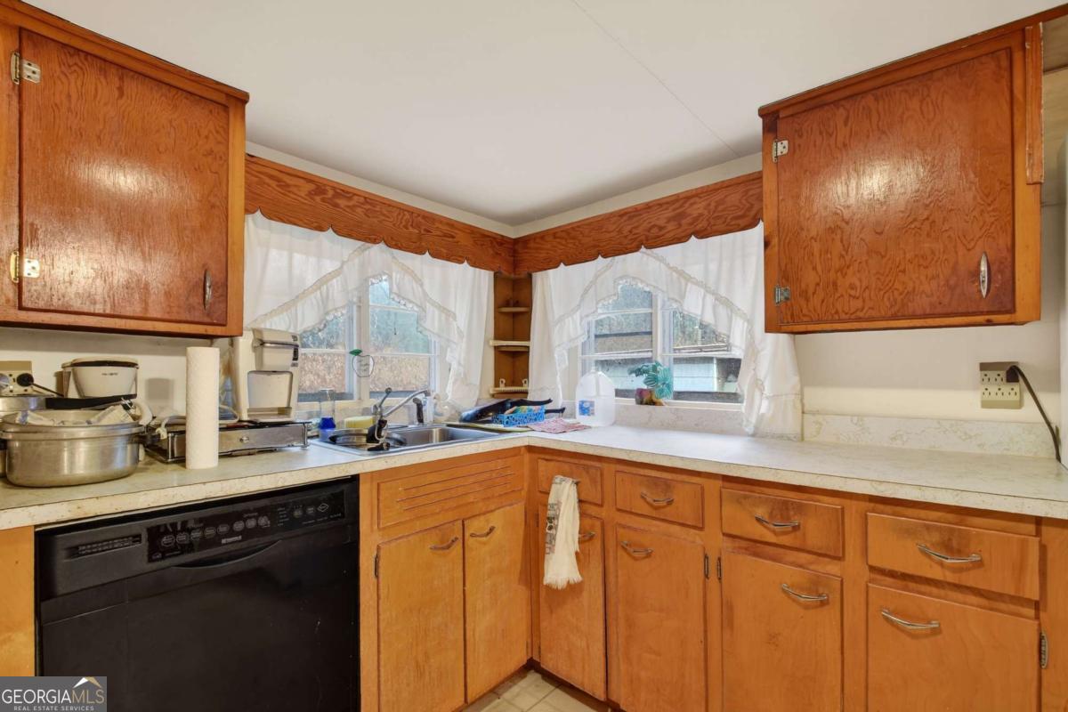 6 Old Aska Curve Blue Ridge, GA 30513 - Photo 19 of 26 a kitchen with stainless steel appliances a sink and cabinets