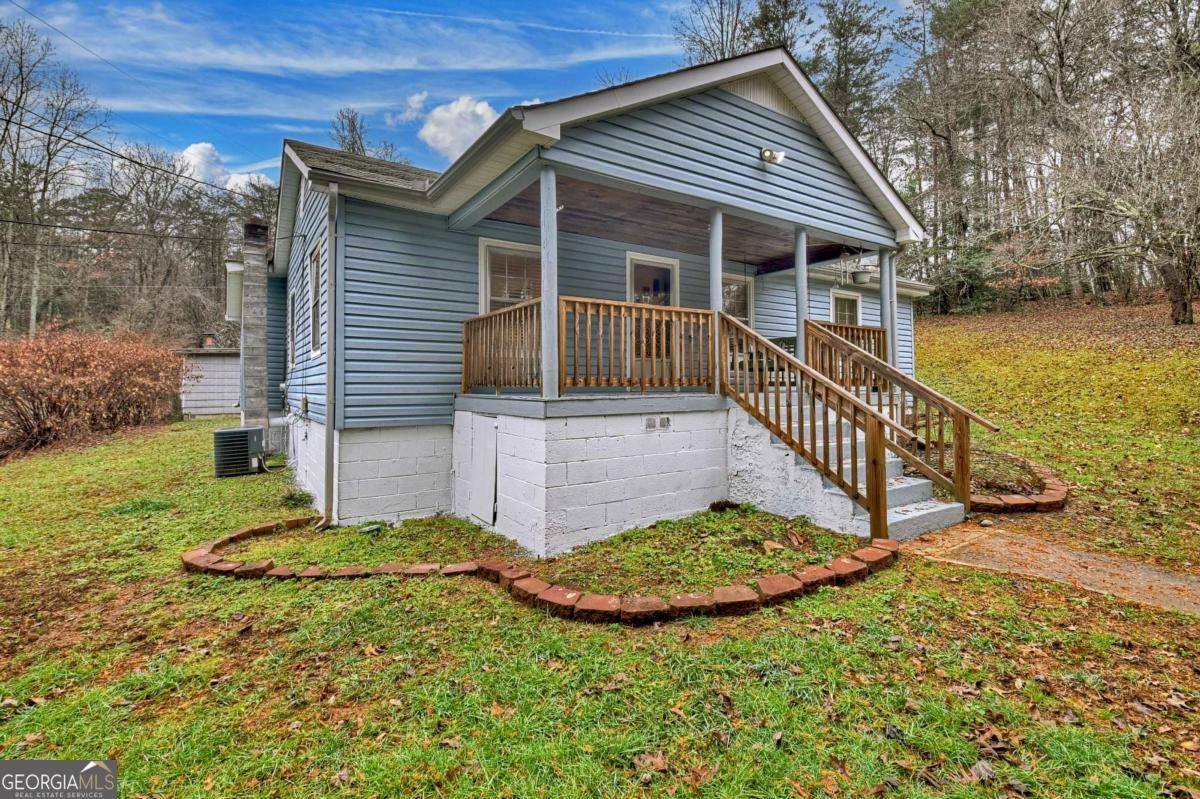 6 Old Aska Curve Blue Ridge, GA 30513 - Photo 2 of 26 a view of a house with a small yard and wooden fence