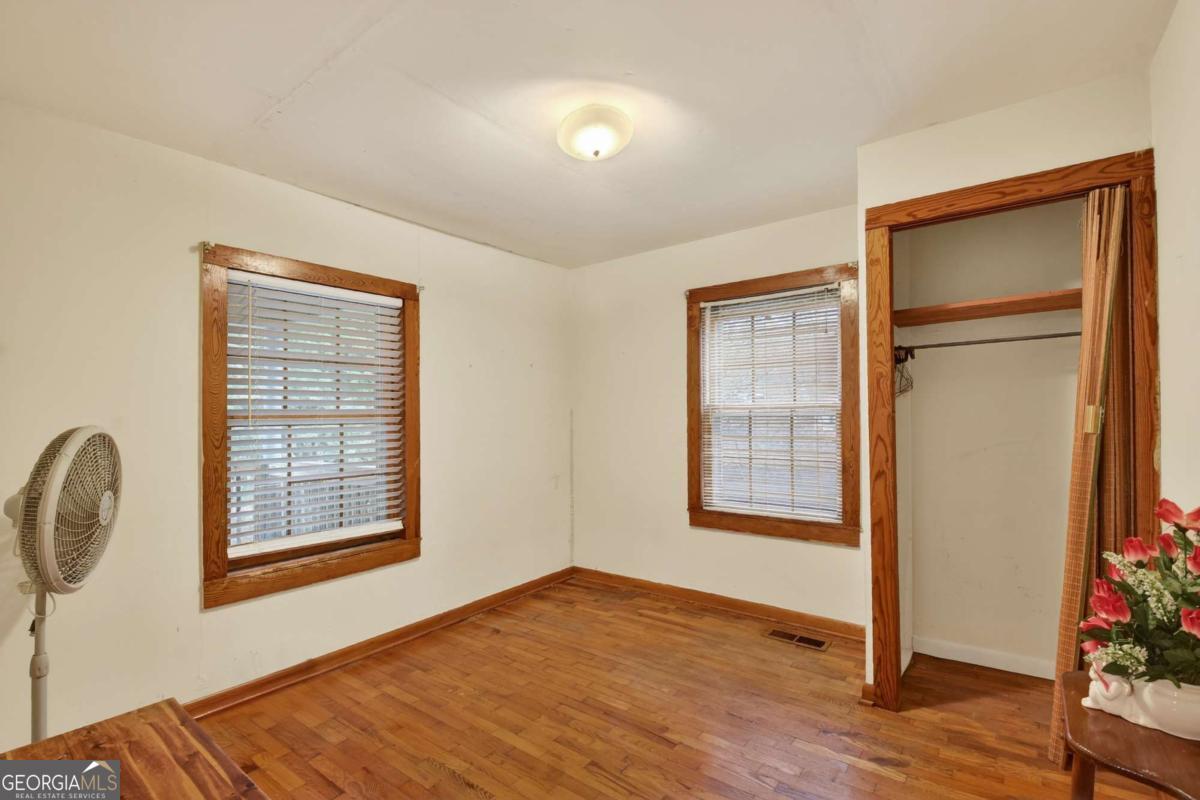 6 Old Aska Curve Blue Ridge, GA 30513 - Photo 24 of 26 a view of an empty room with wooden floor and a window