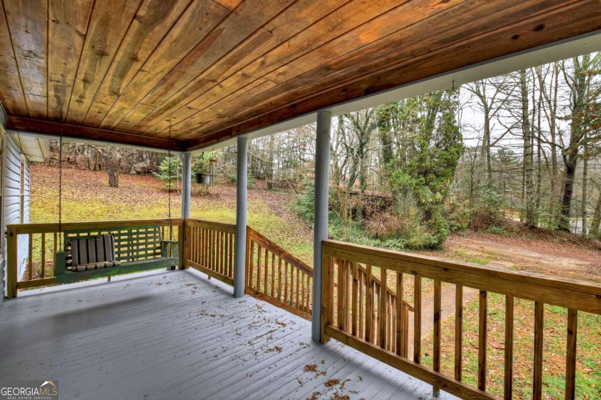 6 Old Aska Curve Blue Ridge, GA 30513 - Photo 10 of 26 a view of a porch with wooden floor and outdoor space