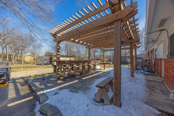 a view of a swimming pool with outdoor seating