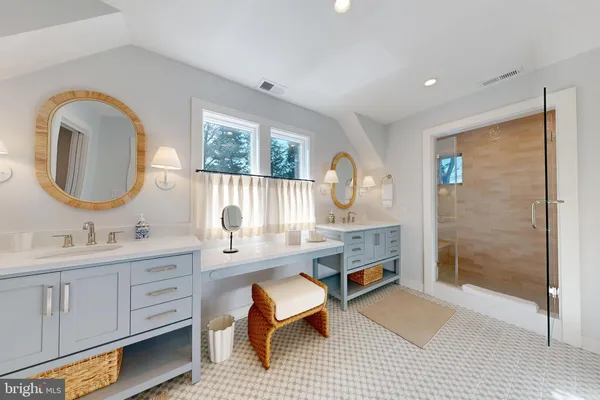 a view of washer and dryer with kitchen in the background