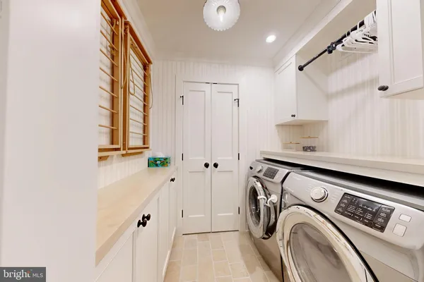 a bathroom with a granite countertop sink mirror vanity and toilet