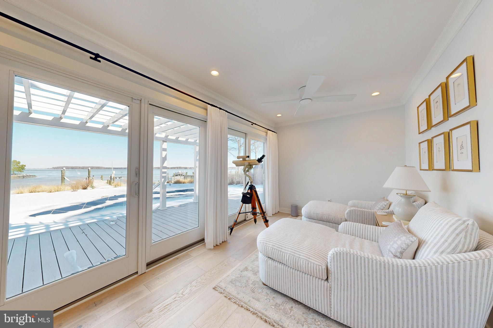 601 Cove Road St. Michaels, MD 21663 - Photo 20 of 39 a living room with furniture and a large window