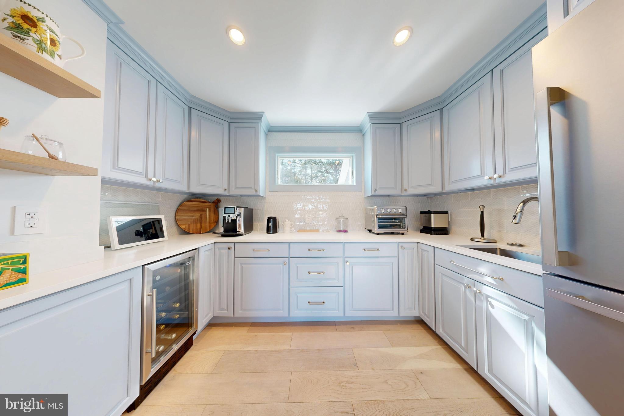 601 Cove Road St. Michaels, MD 21663 - Photo 21 of 39 a kitchen with a cabinets and white appliances