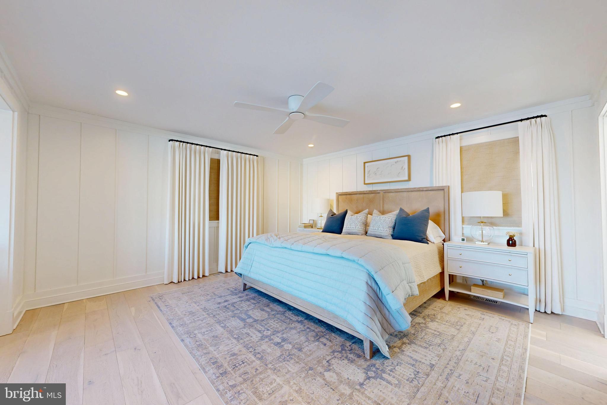 601 Cove Road St. Michaels, MD 21663 - Photo 31 of 39 a spacious bedroom with a bed and a night stand