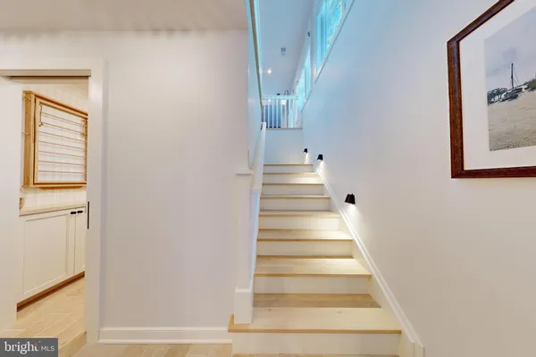 a spacious bedroom with a bed and a large window