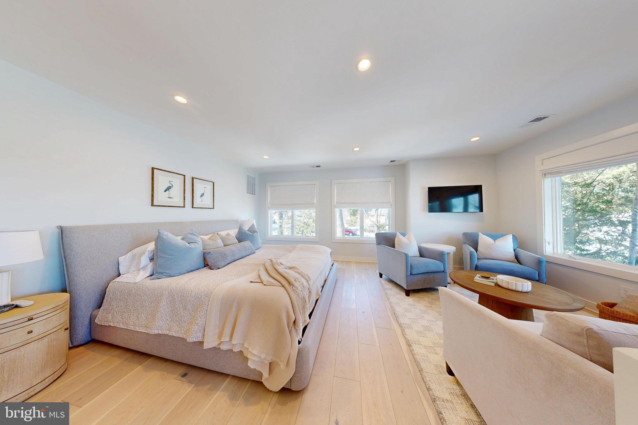 601 Cove Road St. Michaels, MD 21663 - Photo 34 of 39 a spacious bedroom with a bed and a large window