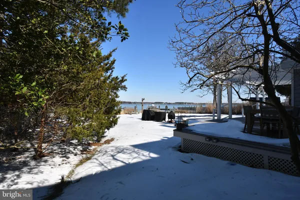 a view of a backyard with swimming pool