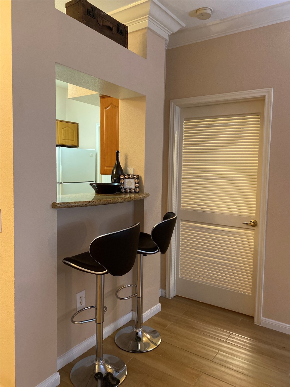 3231 Allen Parkway, Unit 2107 Houston, TX 77019 - Photo 12 of 48 a table chair sitting in a room next to a window