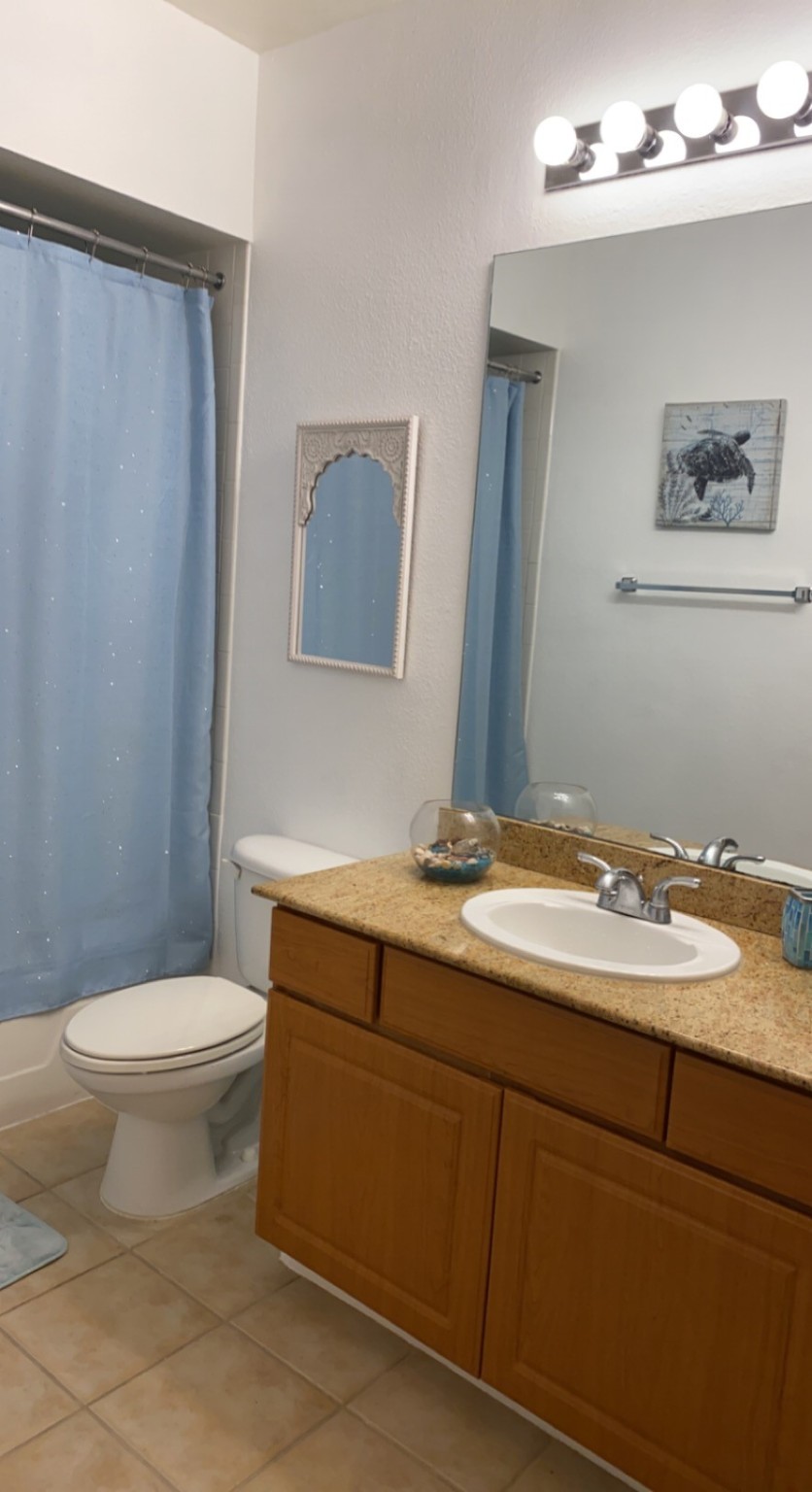 3231 Allen Parkway, Unit 2107 Houston, TX 77019 - Photo 19 of 48 a bathroom with a granite countertop sink toilet and mirror