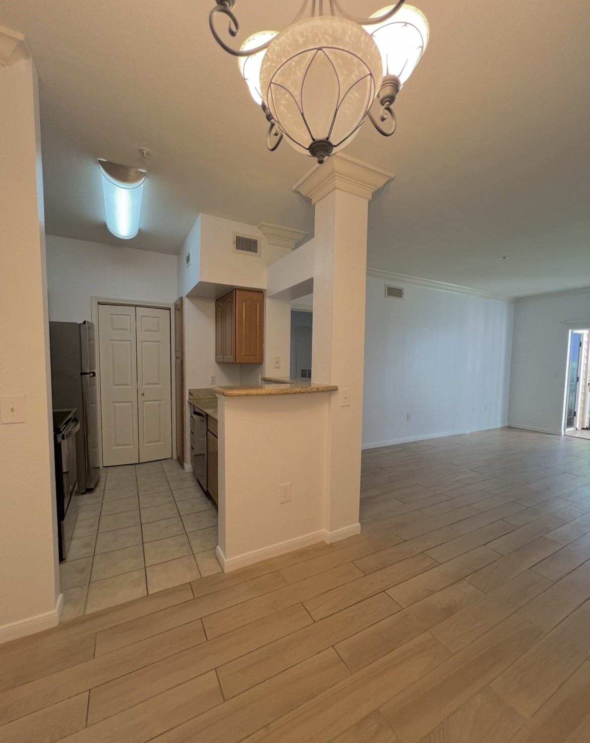 3231 Allen Parkway, Unit 2107 Houston, TX 77019 - Photo 25 of 48 a kitchen with stainless steel appliances granite countertop a sink a stove oven and cabinets