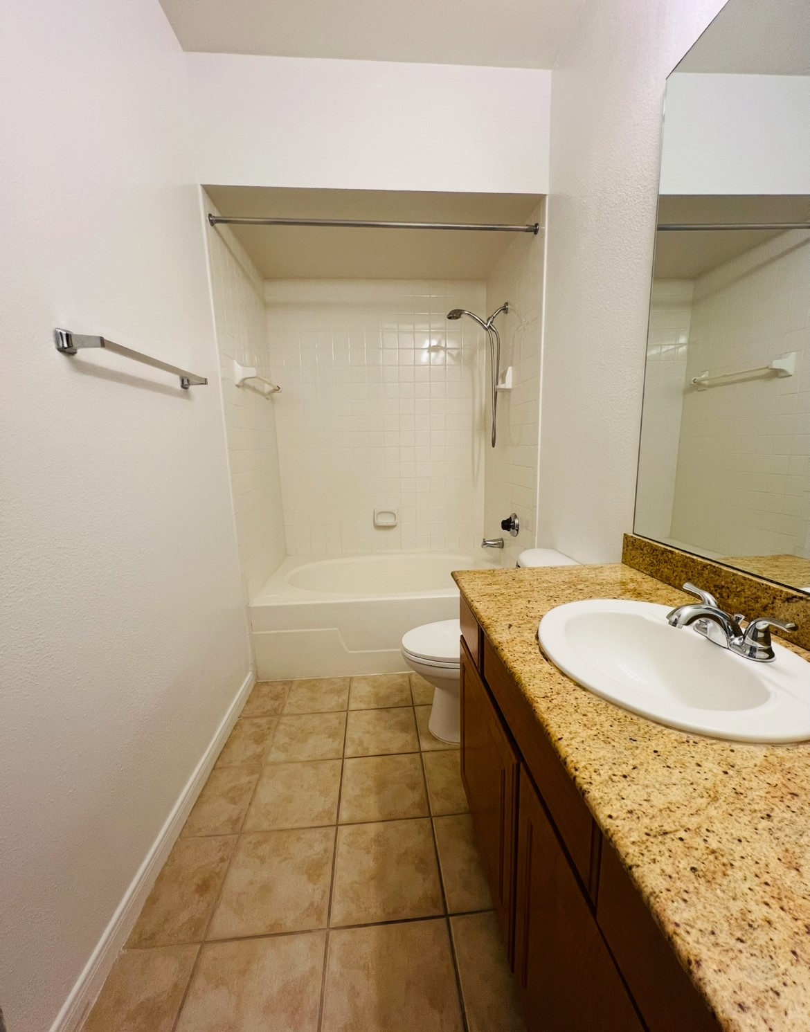 3231 Allen Parkway, Unit 2107 Houston, TX 77019 - Photo 39 of 48 a bathroom with a granite countertop sink a toilet and shower