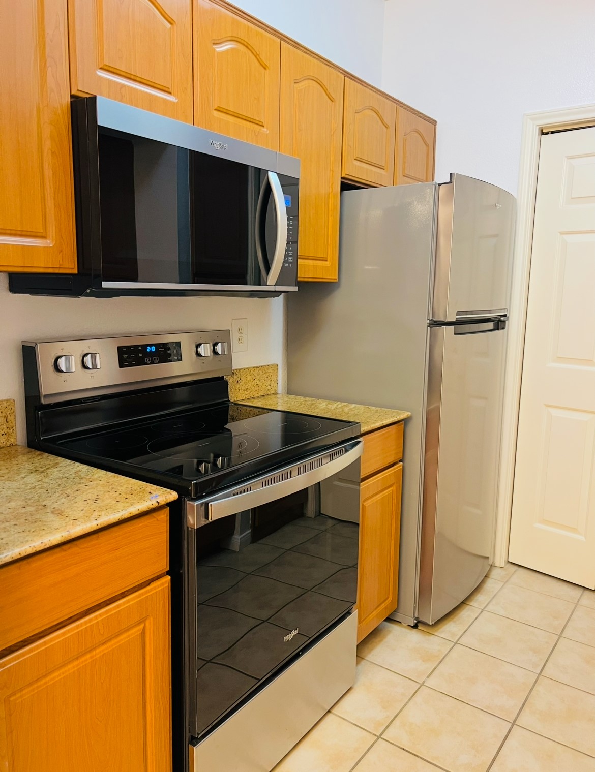 3231 Allen Parkway, Unit 2107 Houston, TX 77019 - Photo 45 of 48 a kitchen with stainless steel appliances a stove microwave and refrigerator