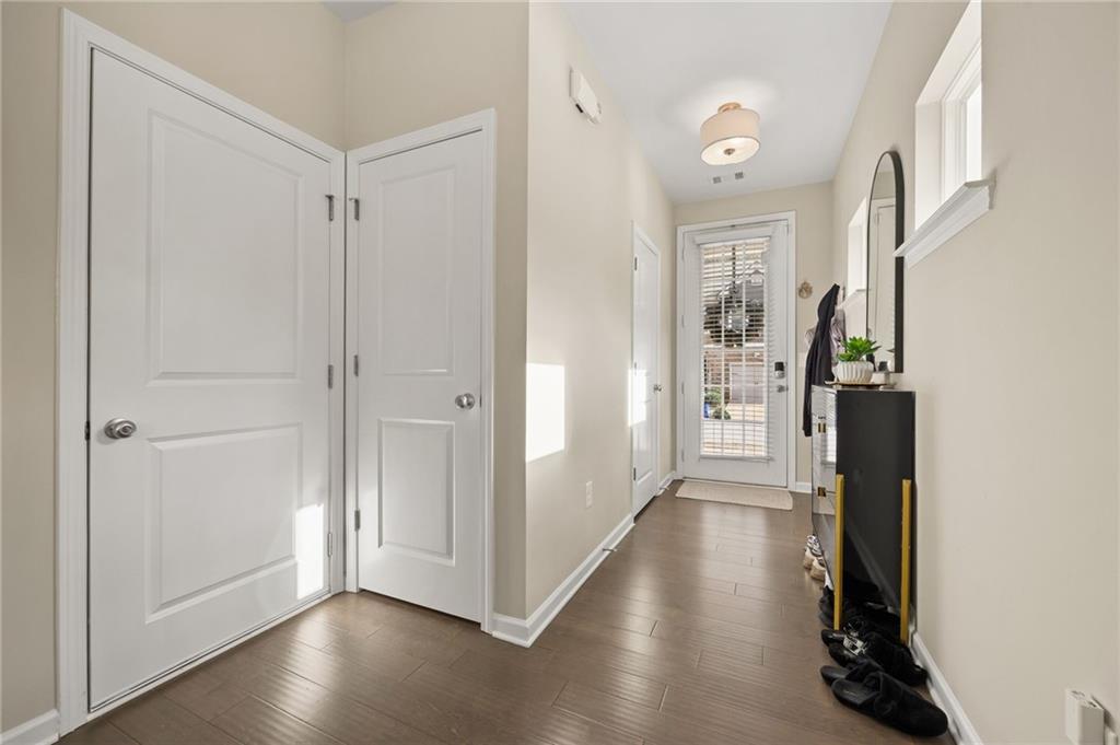 5011 Longview Walk Decatur, GA 30035 - Photo 3 of 26 a view of a hallway with wooden floor and closet