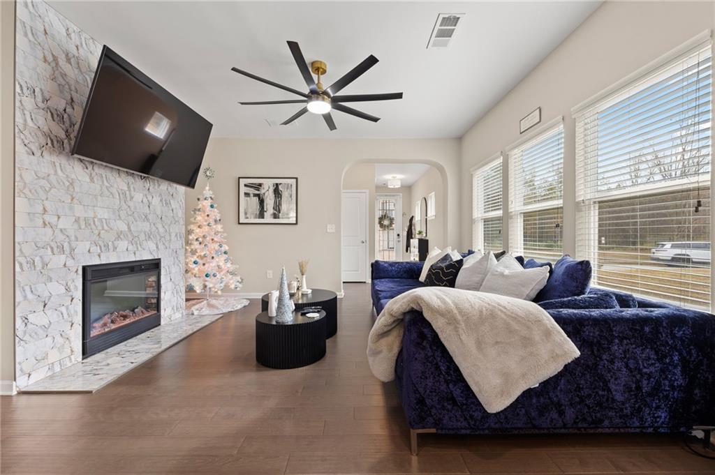 5011 Longview Walk Decatur, GA 30035 - Photo 7 of 26 a living room with furniture a fireplace and a flat screen tv