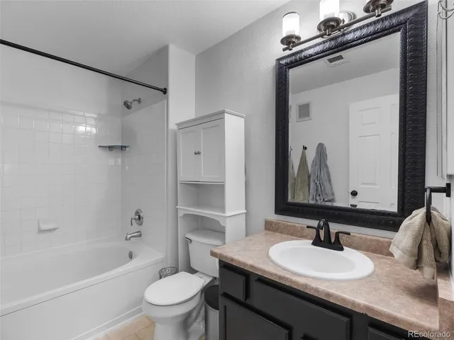 a blue chair sitting in front of a window