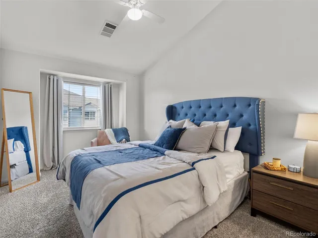 a bedroom with a bed and walk in closet