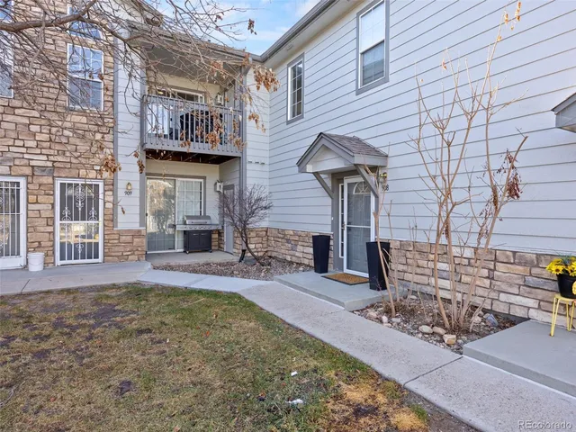 a front view of a building with outdoor seating
