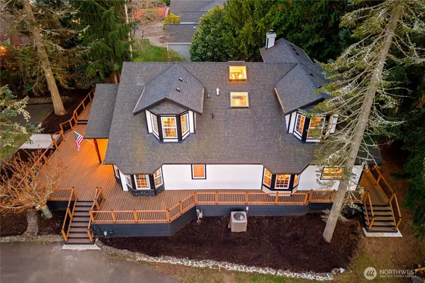 an aerial view of a house with swimming pool