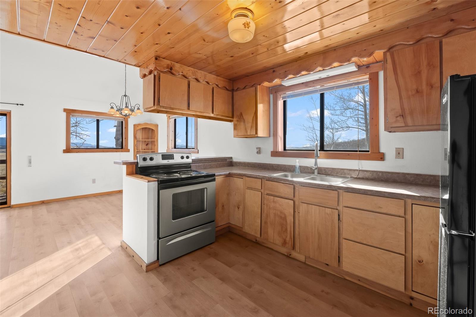 1793 Michigan Hill Road Jefferson, CO 80456 - Photo 15 of 44 a kitchen with granite countertop stainless steel appliances a sink and cabinets