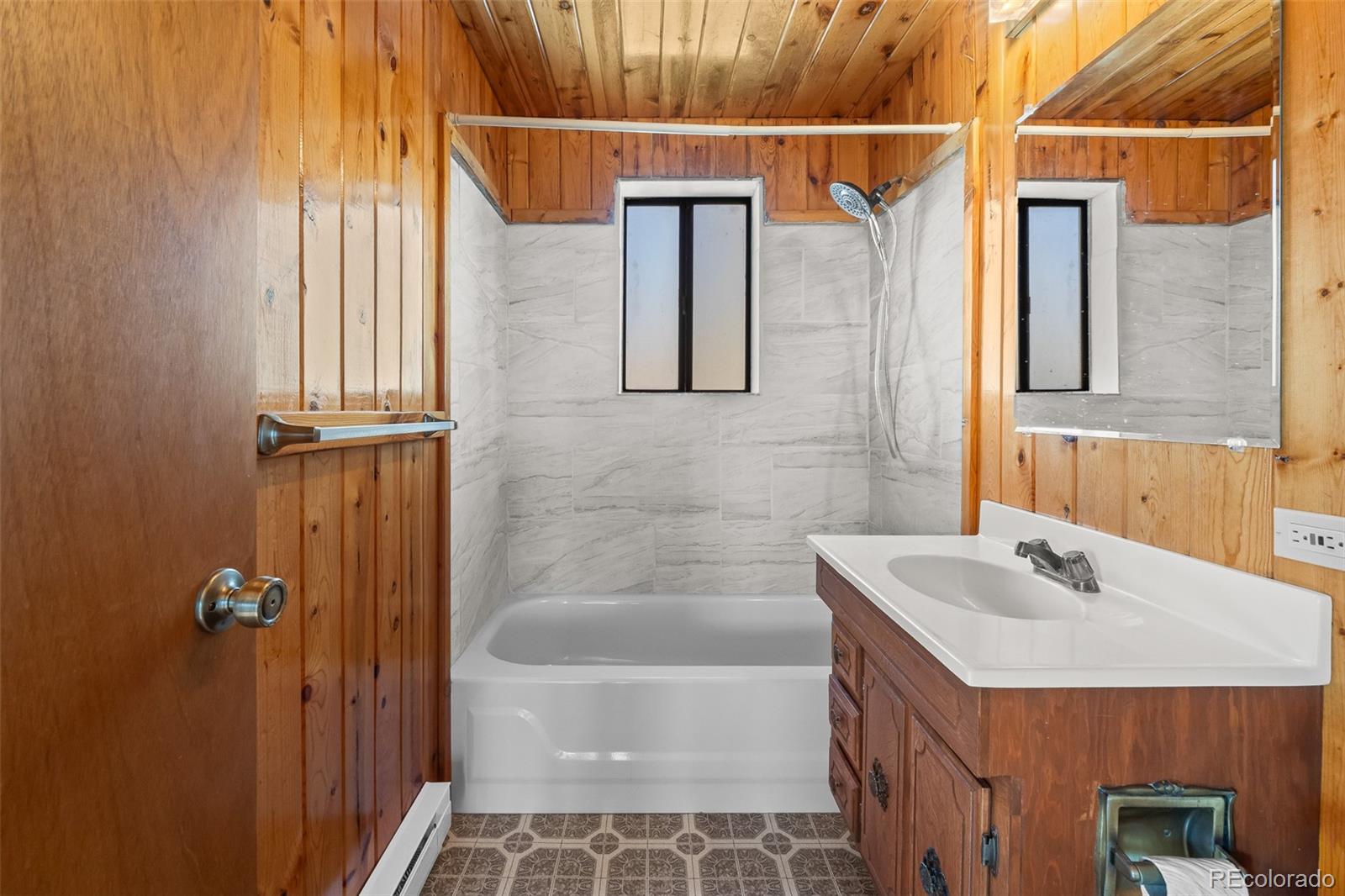 1793 Michigan Hill Road Jefferson, CO 80456 - Photo 26 of 44 a bathroom with a sink and a mirror