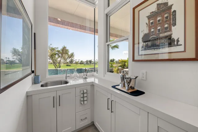 a large spacious bathroom with a double vanity sink a mirror and a shower