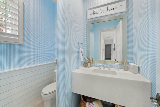 a bathroom with a sink a vanity and a mirror