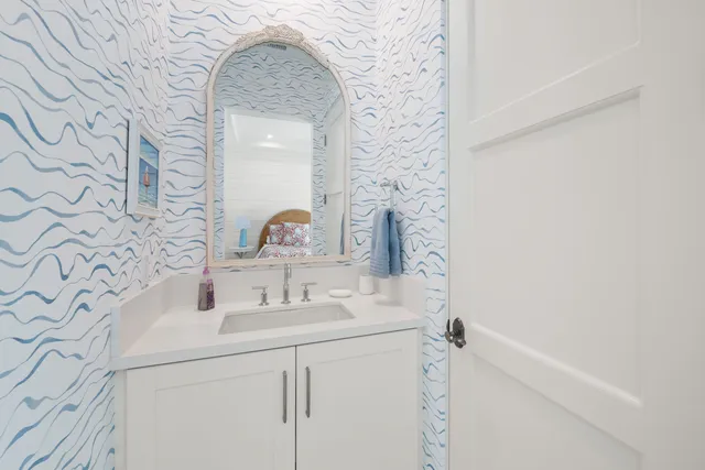 a bedroom with a bed and a table