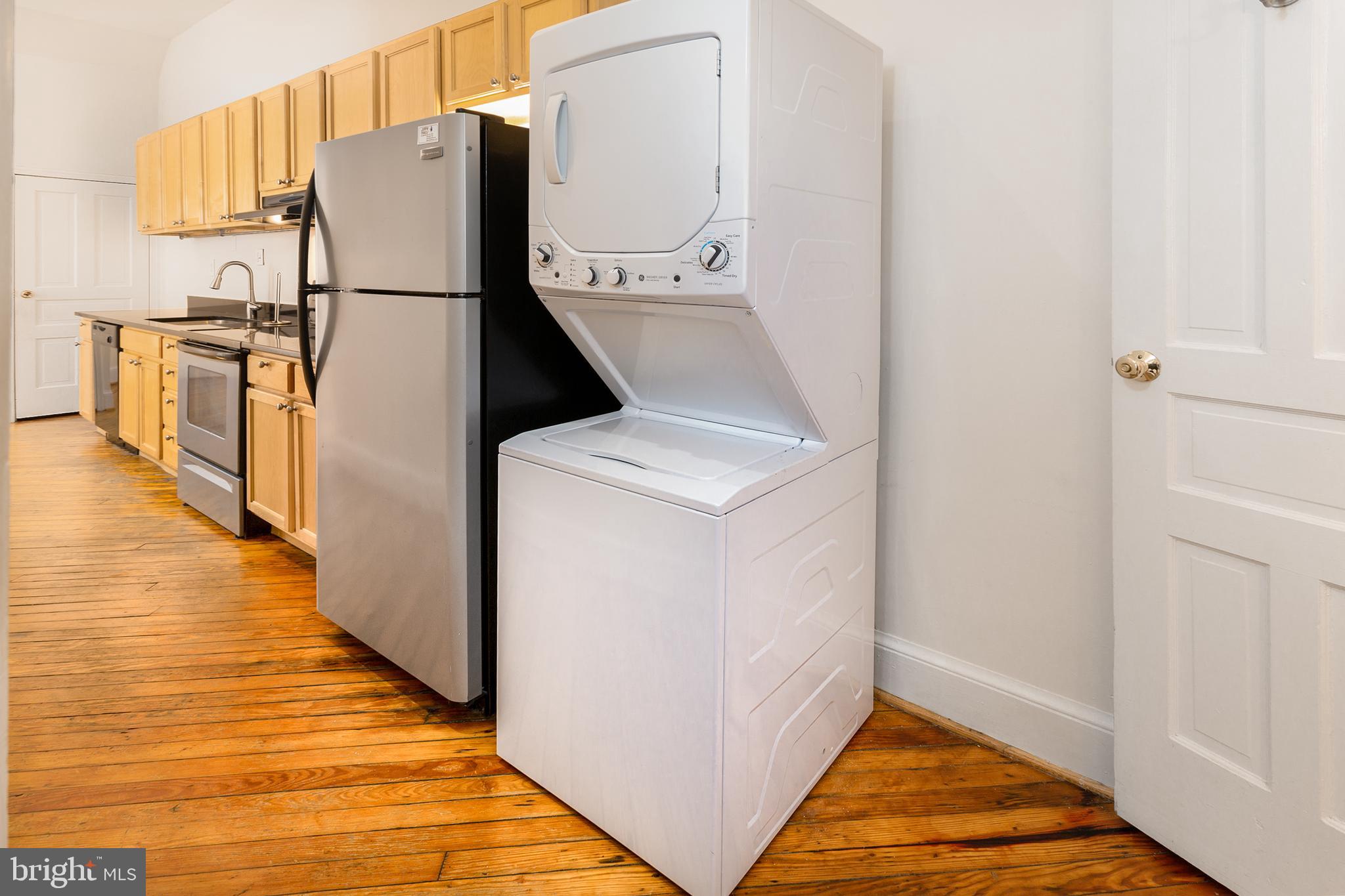 1213 12th Street Northwest, Unit A Washington, DC 20005 - Photo 12 of 25 a view of a kitchen with wooden floor and electronic appliances