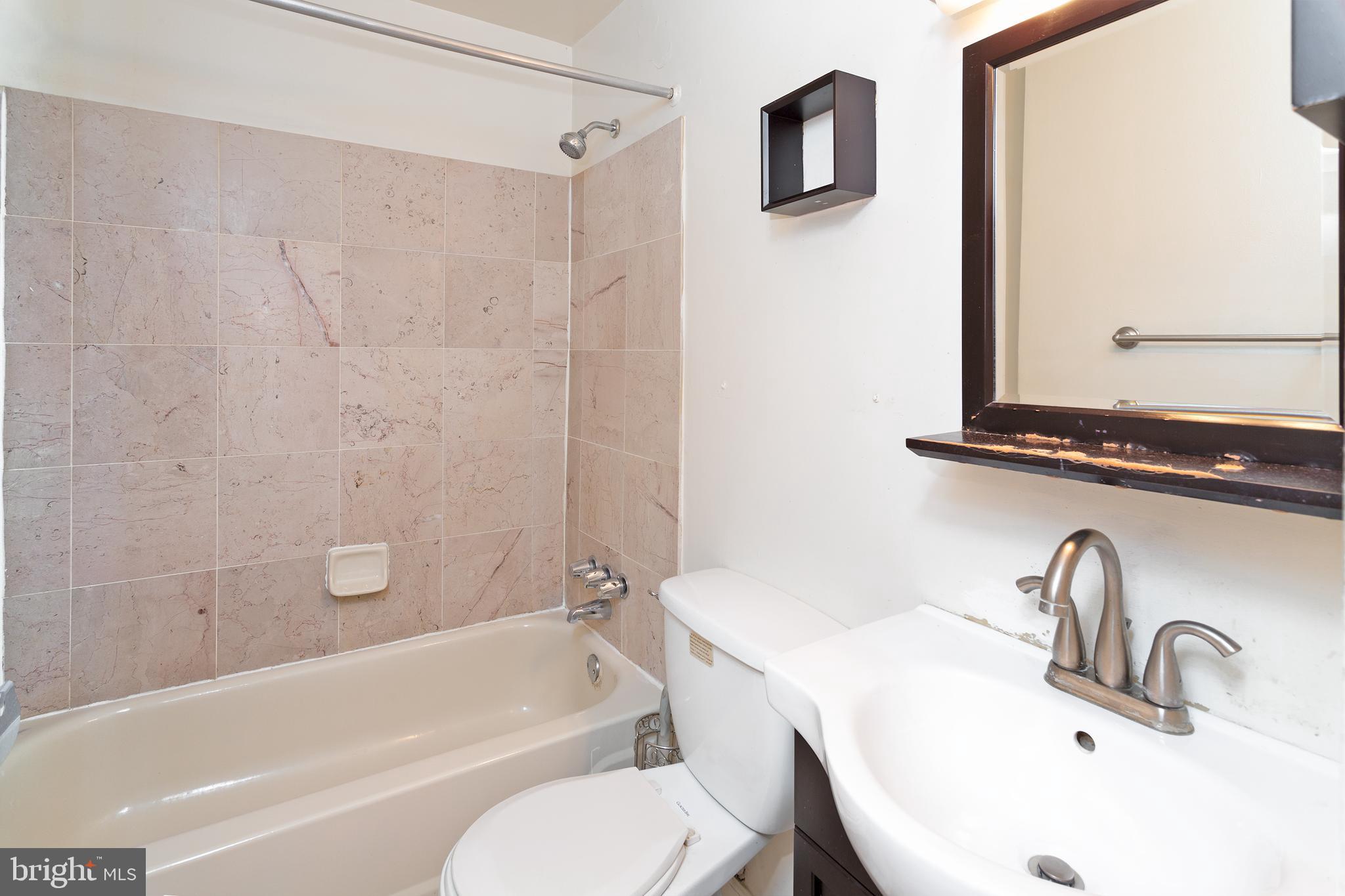 1213 12th Street Northwest, Unit A Washington, DC 20005 - Photo 13 of 25 a bathroom with a sink toilet and shower
