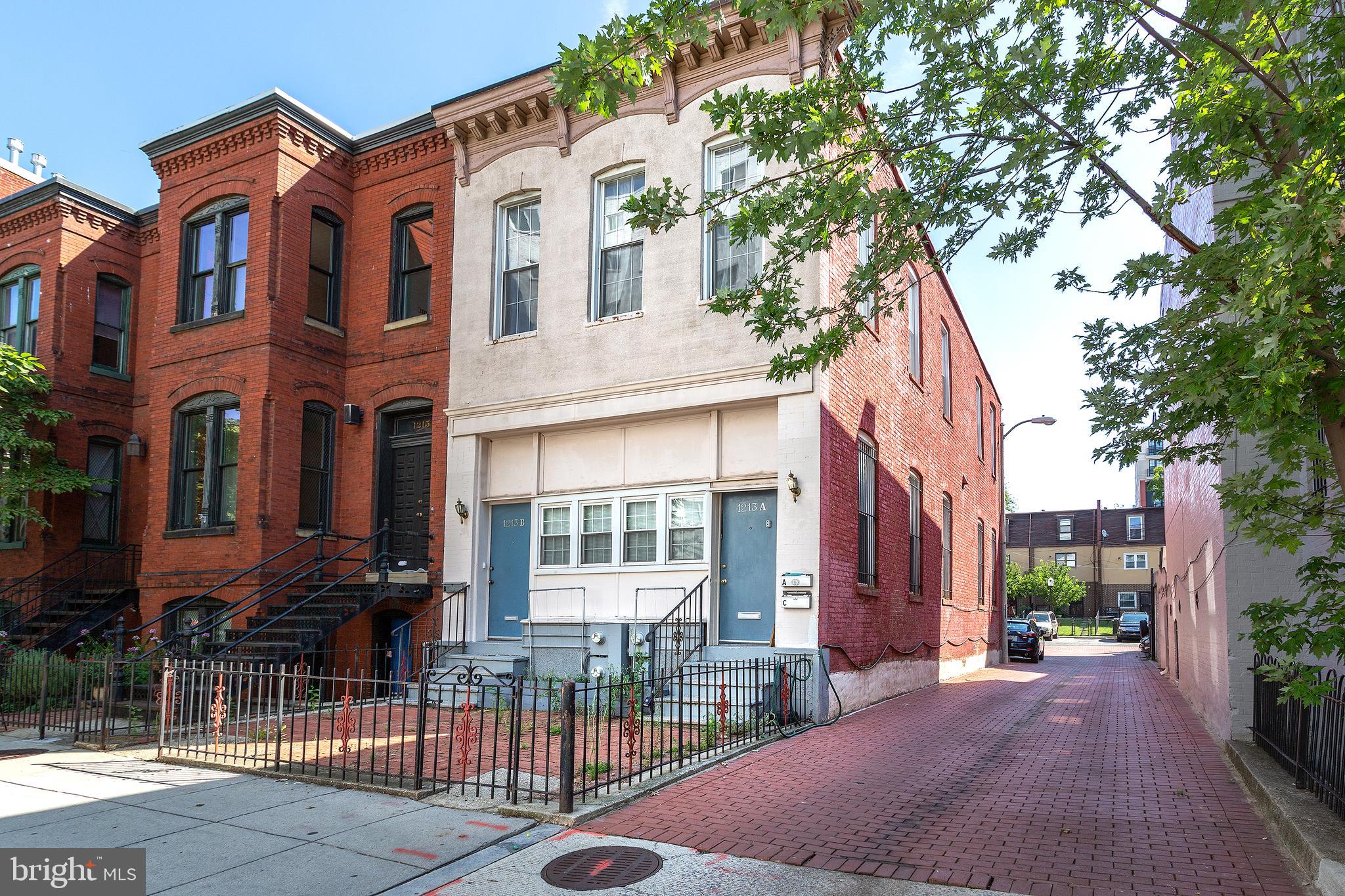 1213 12th Street Northwest, Unit A Washington, DC 20005 - Photo 3 of 25 a view of a brick building with many windows