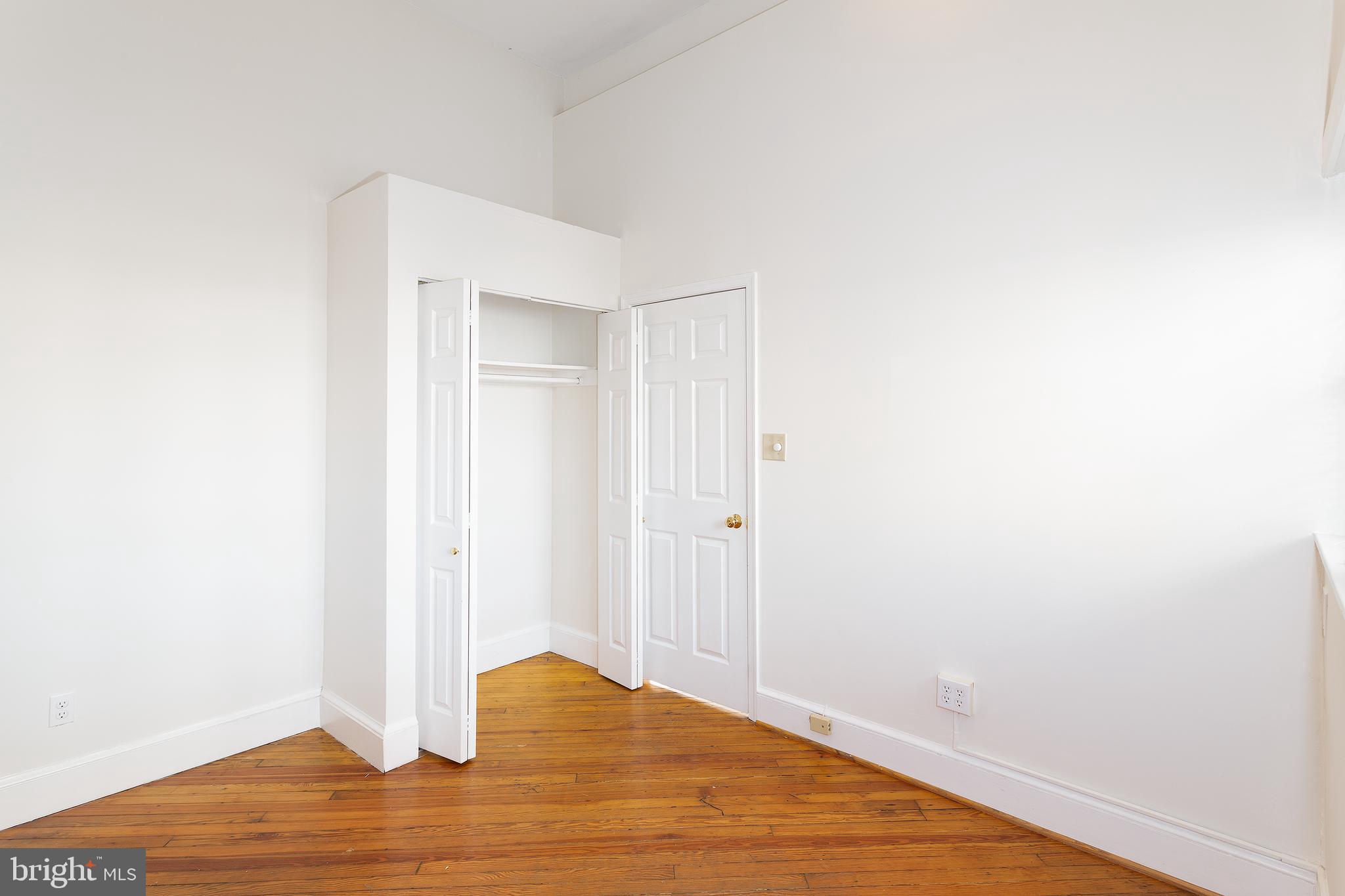1213 12th Street Northwest, Unit A Washington, DC 20005 - Photo 8 of 25 a view of empty room with wooden floor