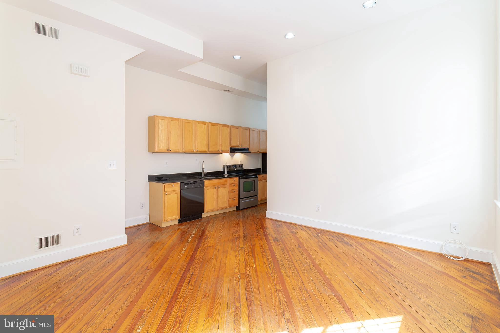 1213 12th Street Northwest, Unit A Washington, DC 20005 - Photo 9 of 25 a view of kitchen with utility room and wooden floor